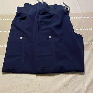 TWO Pairs women’s Fig tech scrub pants. Size medium, color Navy